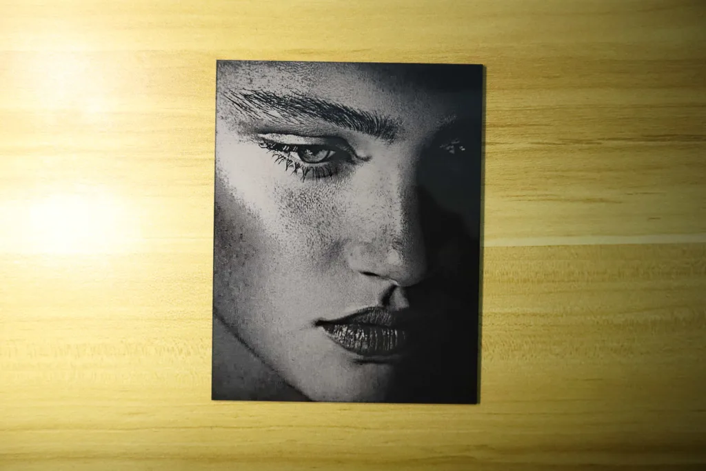 High-definition portrait engraved on black acrylic