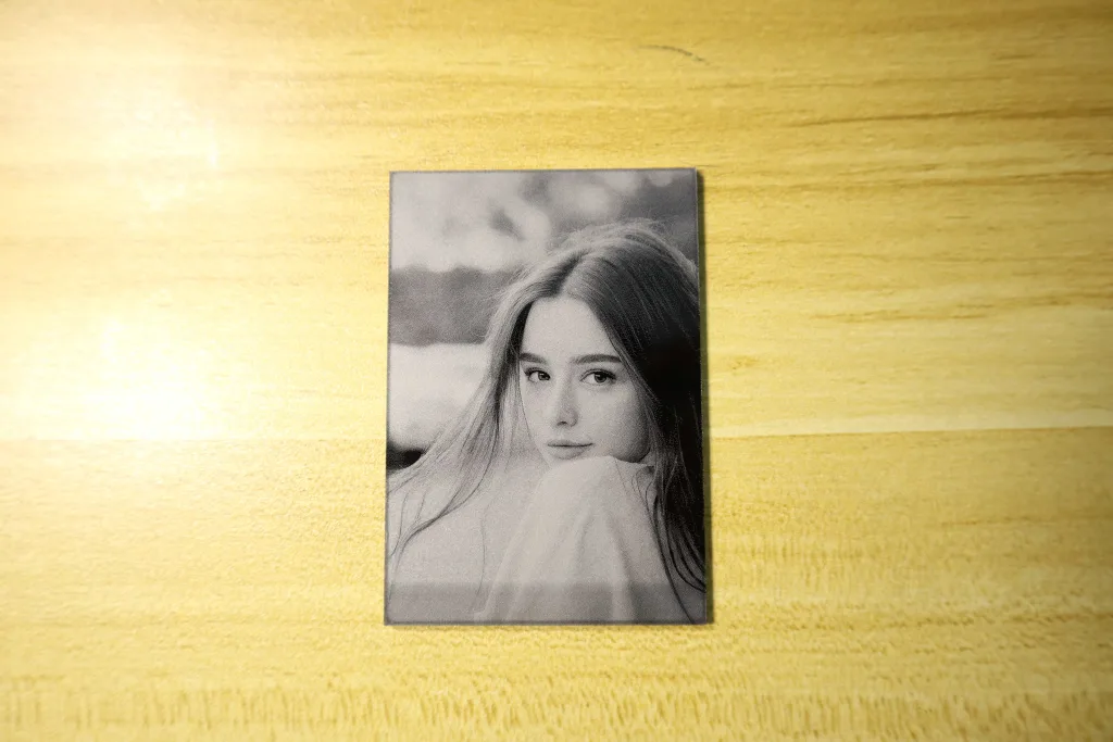 High-definition portrait engraved on black acrylic